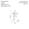 White cast iron starfish wall hook with detailed ocean themed texture and screw mount - Cast Iron / Starfish