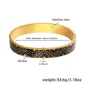Macro detail of 18k gold plated stainless steel bangle with black enamel drip pattern - Black (Z528-Black Drip Oil Bracelet)