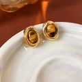 Close-up of vintage gold plated tiger eye earrings on a white ceramic iridescent plate - Gold Plated Brown (Silver Pin)