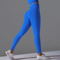 Detail view of seamless high waist ribbed yoga leggings and top set in bright blue color - Electric Blue