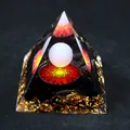 Orgone crystal pyramid with red mandala design, black stone chips, and gold foil accents - Red Eye Mandala / Small