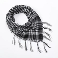 Detail of black and white shemagh scarf with houndstooth pattern and tassel edges - White