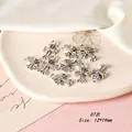 Macro detail of 10 vintage silver alloy cross charms for DIY jewelry making 12x19mm - Cross Style 07 / Antique Silver