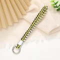 Détail de la dragonne tissée avec cordon à motif jaune, noir et blanc élégant - Largeur 12mm / Jaune/Blanc