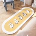 Oval plush bedroom rug in yellow and white featuring five cute cartoon duck patterns - Pipi Duck
