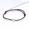 Adjustable minimalist brown cord bracelet featuring a small silver heart pendant - Brown/Silver