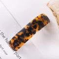 Detail shot of rectangular tortoiseshell acetate hair clip on a minimalist white card - 7# Spring Clip (Classic Amber Tortoise)