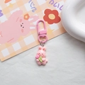 Close-up of a cute pink rabbit keychain with flower detail and matching metal clip - Pink Flower Rabbit