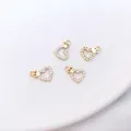 Macro shot of four 14K gold plated heart crown charms with micro paved cubic zirconia - Type 7 Crown Heart 8x11mm