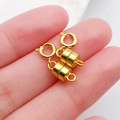 Pair of gold cylindrical magnetic jewelry clasps held in hand for DIY bracelets - Gold Cylindrical Magnetic Spring Clasp / 19x7mm