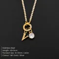 Elegant 14K gold plated stainless steel necklace with V initial and sparkly stone - Letter V