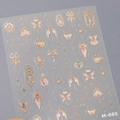 Self-adhesive nail sticker M-685 featuring rose gold lace corsets and wings with foil accents - M-685-Colored Gold
