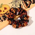 Detailed view of Halloween scrunchies with pumpkin and bat patterns on satin fabric - Pumpkin Black / Large Size