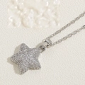 Elegant silver star pendant necklace with cubic zirconia on a minimalist textured surface - White Zirconia (XL2593-4) / Silver