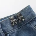 Obsidian black mini bear button on blue jeans used as a metal waist cincher clip - Hand-sewn Bear / Obsidian Black