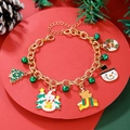 Detailed shot of Christmas charm bracelet with snowman, tree and bells on red festive stand - D1240 (Snowman Tree Combo)