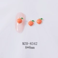 Macro detail of 8x8mm peach-shaped alloy nail charms with pink resin and green leaves - Pink Orange Peach (Gold Base) (8342)