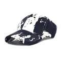 Detail shot of a baseball cap featuring black and white abstract map patterns and stitching - Navy Blue