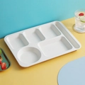 White wheat straw divided dinner tray with six compartments on a blue and yellow background - White