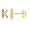 Macro shot of S925 hallmark on a gold-plated letter K stud earring with white stones - Gold K