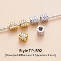 Macro detail of cylindrical zircon spacer beads with 18K gold and platinum plating - TPJ592-White Zircon