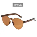 Rimless one-piece cat-eye sunglasses with scalloped brown lenses and candy color design - Transparent Tea