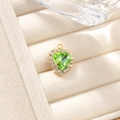 Green heart gemstone pendant with gold-plated diamond border in a beige velvet jewelry box - Light Green Pendant