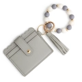 Gray faux leather wallet with beaded wristlet keychain and elegant tassel charm - Gray