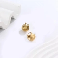 Close-up of gold U-shaped earrings featuring a vintage hammered metal texture finish - Hollow Design