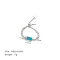Verstellbarer Silberkettenring mit blauem Zirkon-Rechteck und klaren Akzenten - Ring / Silber/Paraiba Blau