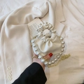 Elegant white pleated handbag featuring a large pearl handle and golden chain strap - White