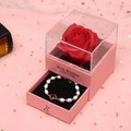 Pink jewelry box with preserved red rose and pearl clover bracelet on starry gauze - Pink Box/Red