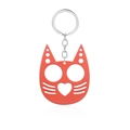 Macro view of red cat-shaped metal self-defense keychain with two finger holes - Justice Cat Orange (K00636-07)