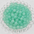 Macro shot of 4-8mm pale green round glass beads in a decorative tray for DIY jewelry - 4mm / Cyan Blue
