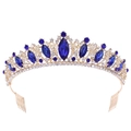 Close-up of golden bridal tiara with blue gemstones and sparkling rhinestones - Gold Blue Rhinestone