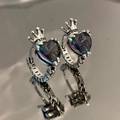 Vintage silver crown earrings with heart rainbow topaz and small hoops on reflective surface - White Gold