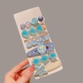 7-piece light blue rhinestone and pearl hair clip set for girls on a white card display - Blue Letter Star 7-piece Set
