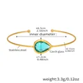 Detail view of 18k gold plated stainless steel cuff with a green teardrop Czech glass stone - Pale Green