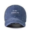 Blue washed denim baseball cap featuring white In My Eras Era embroidery on front - Navy Blue