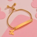 Detail of adjustable gold box chain bracelet with engraved metal plate and butterfly charm - Gold Butterfly