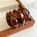 Detailed view of leopard print resin links inside a premium brown velvet jewelry box - Dark Coffee