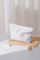 Detailed macro view of minimalist polka dot fabric makeup bag on a wooden tray - Black Polka Dot Large Size