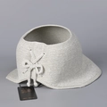Detail view of light grey knitted open top sun hat with bow decoration and hangtag - M (56-58cm) / Light Green