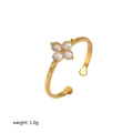 Detailed view of 18K gold-plated stainless steel flower ring with zircon stones - Four Gem Flower Granulated Ring (TR4185-WT)