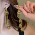 Vintage golden metal Jhumka tassel earrings with bells worn by a model in soft light - 67# Tassel