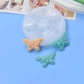 Silicone butterfly bow molds with finished cake decorations on a light blue background - 3 Identical Butterflies Style