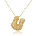 Detailed close-up of gold bubble letter U pendant necklace with inlaid zircons - Letter U (D1079-U)