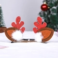 Macro detail of Christmas reindeer antler hair clips with red glitter and plush fur decor - 1 Pair Faux Fur Red Antlers