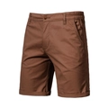 Detail view of men's cargo shorts featuring side pockets and cuffed hem in caramel brown - EU 30 / Brown