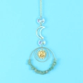 Detail of suncatcher with golden crescent moon, crystal beads and green natural stones - Green Aventurine